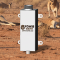 Yowie Gear device in a natural setting with animals in the background